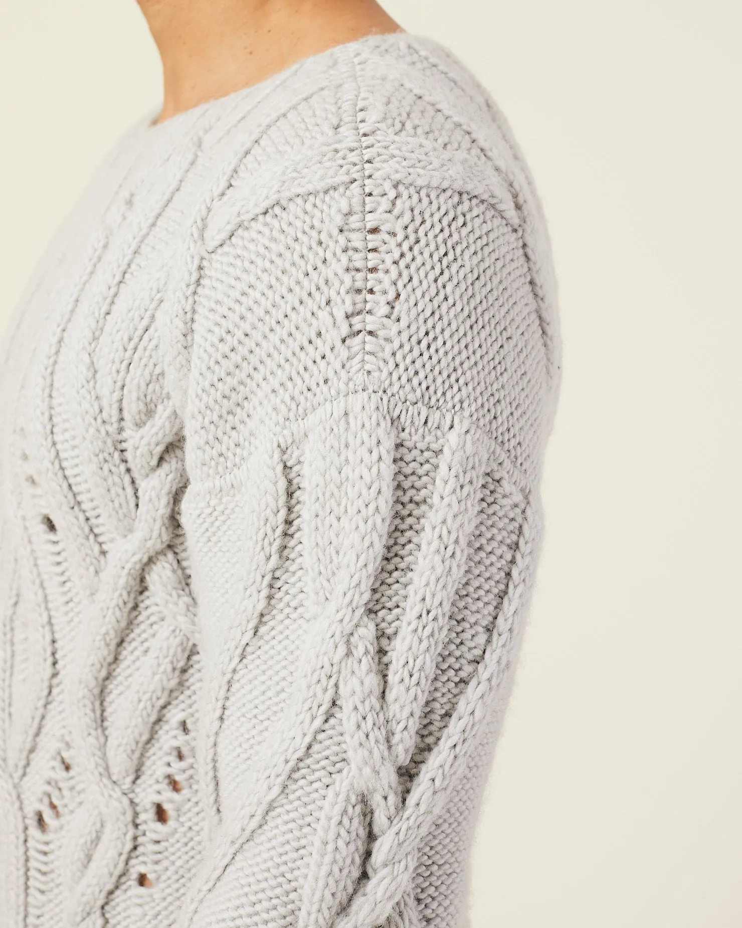 OVERSIZED DISTRESSED CABLE-KNIT SWEATER