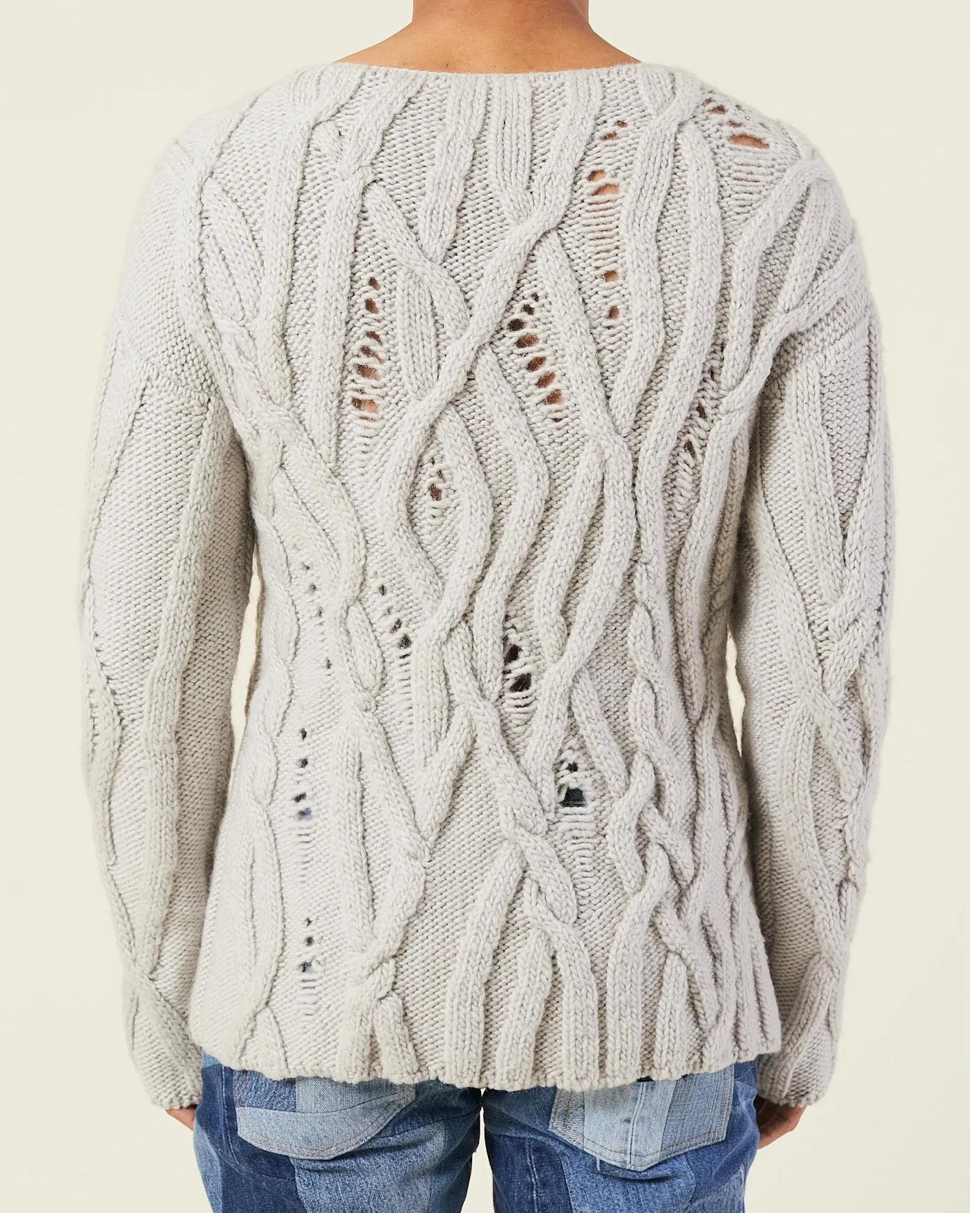 OVERSIZED DISTRESSED CABLE-KNIT SWEATER